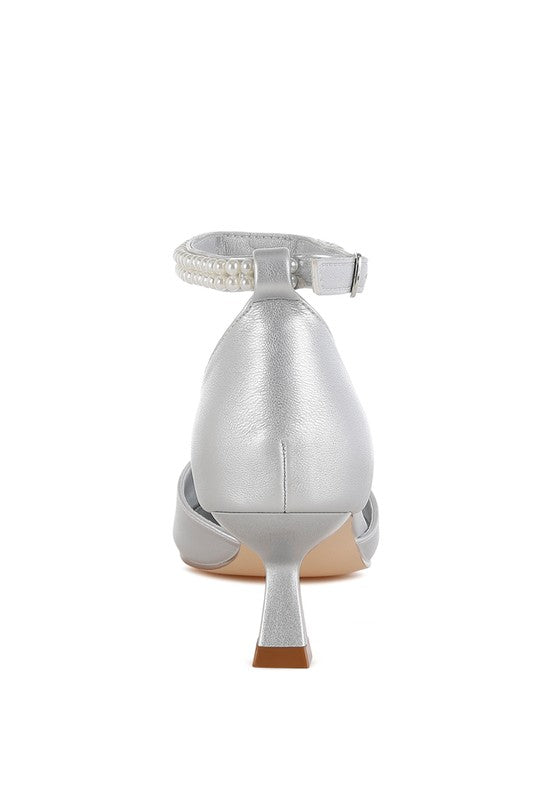 Silver kitten-heel sandal heel view with ankle strap and small heel