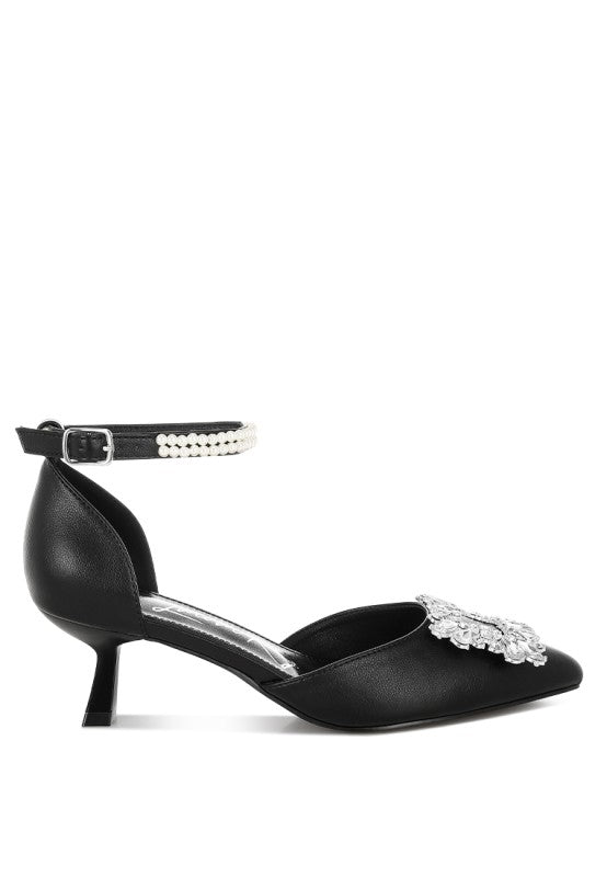 Black kitten heel pumps with rhinestone toe ornament and pearl-trim ankle strap