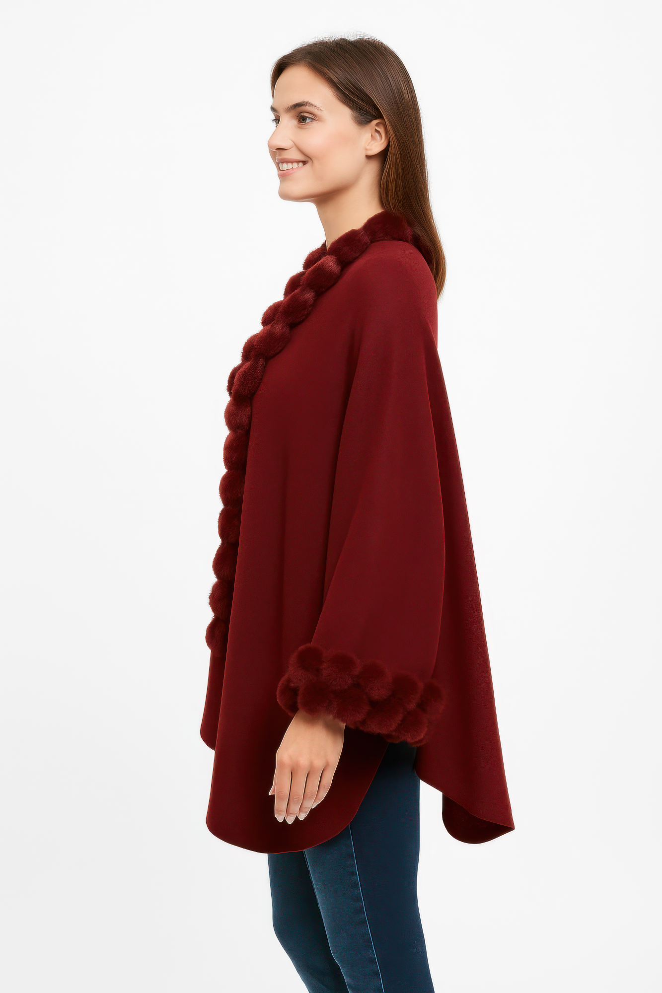 Burgundy open-front cape side view with pom faux fur trim along neckline and cuffs