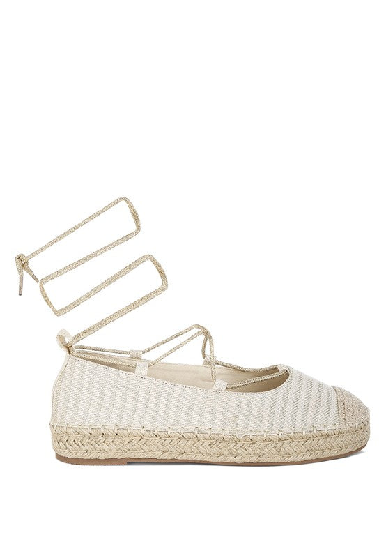 Gold canvas woven espadrille with cross-strap ankle ties and braided jute platform sole