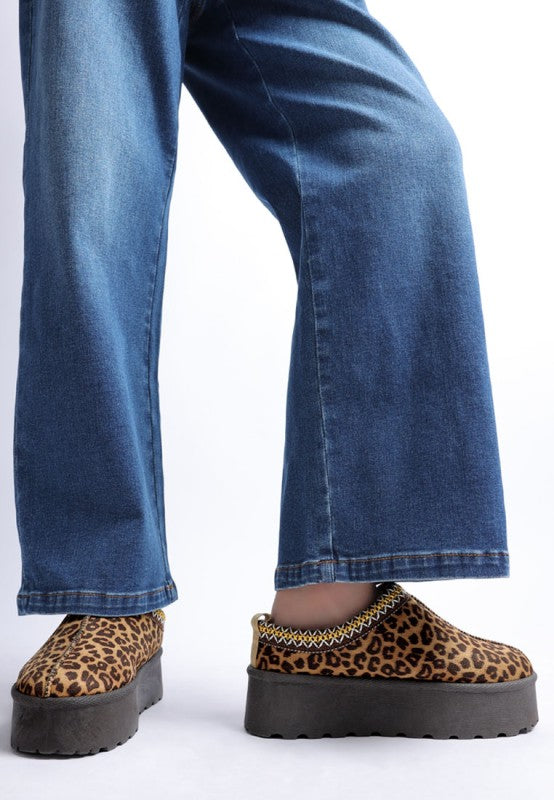 Leopard platform slip-on shoes with chunky lug sole and stitched collar