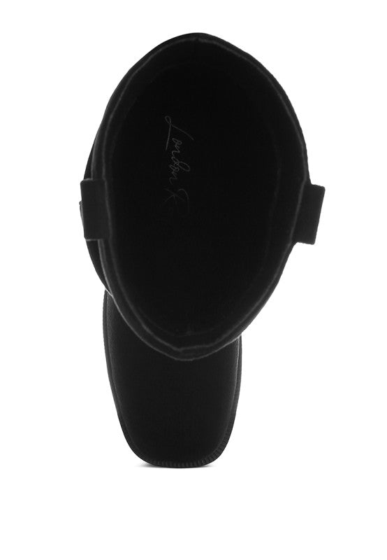 Black slouch cowboy boots inner view: cushioned lining and pull-on opening