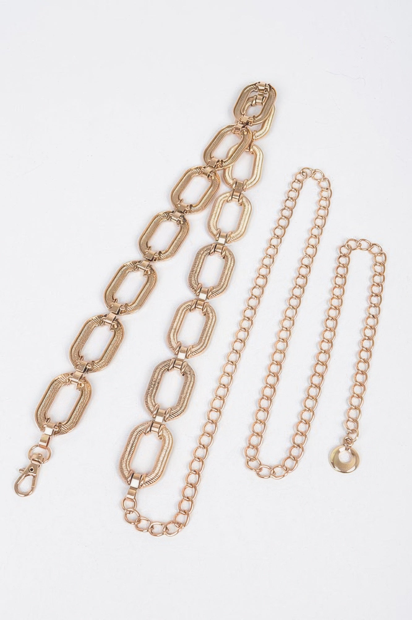 Gold oval-link chain belt set with clasp and matching chain tassels