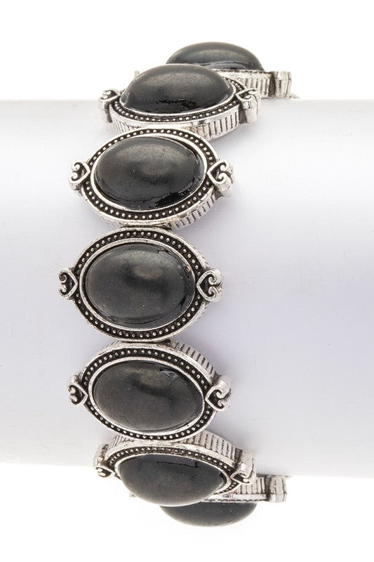 Oval stone western stretch bracelet, black cabochons with silver-toned filigree cuff