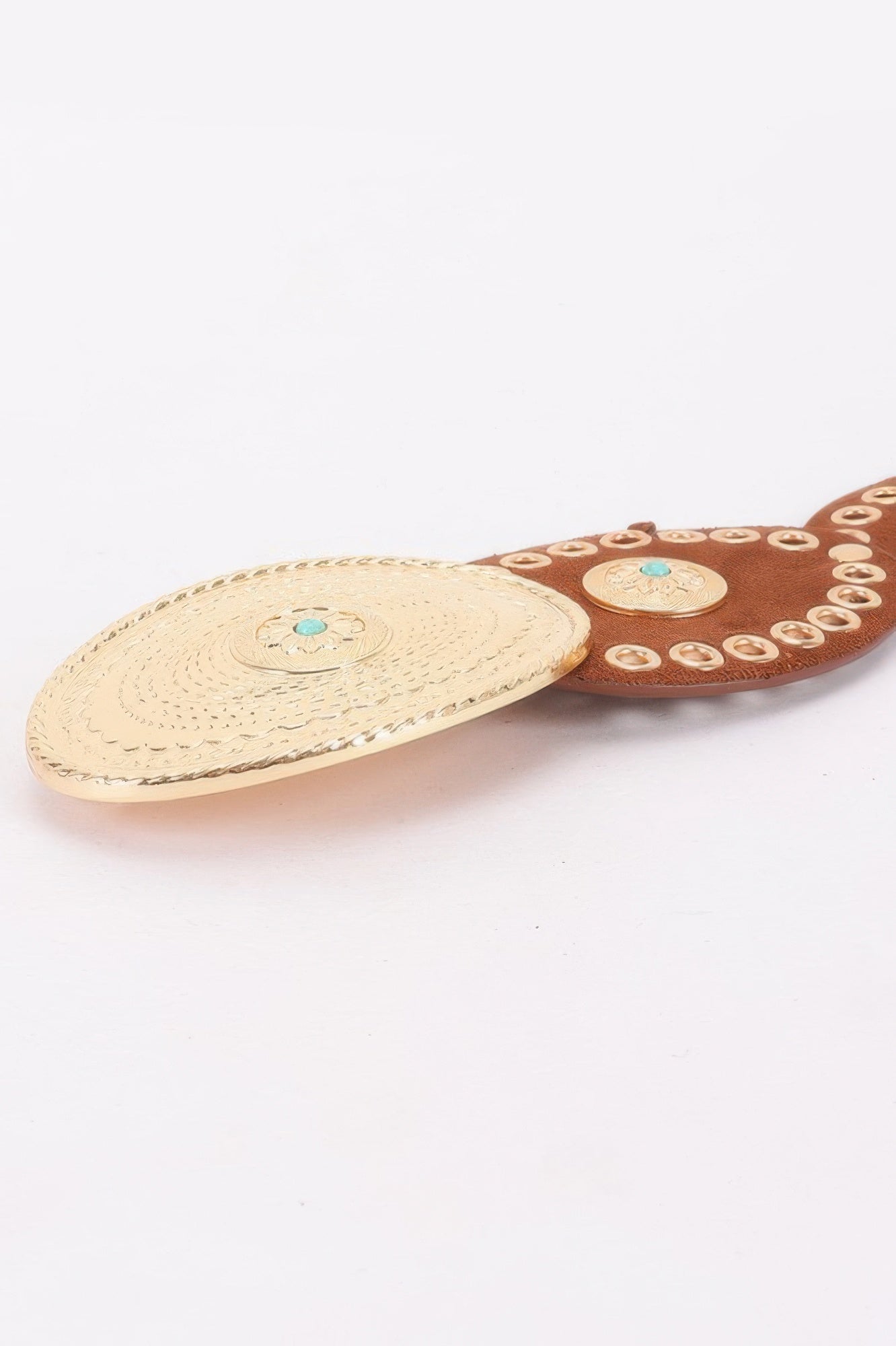 Camel oval belt with stitched oval panel and studded dot border, close-up