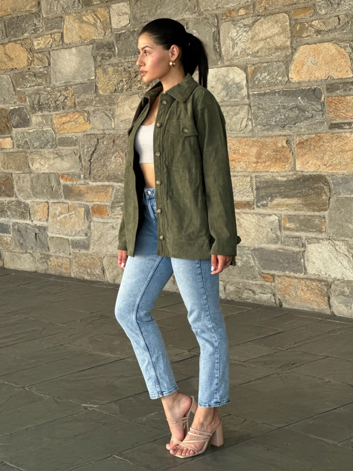 Olive corduroy shacket with long sleeves, utility buttons, and chest pockets