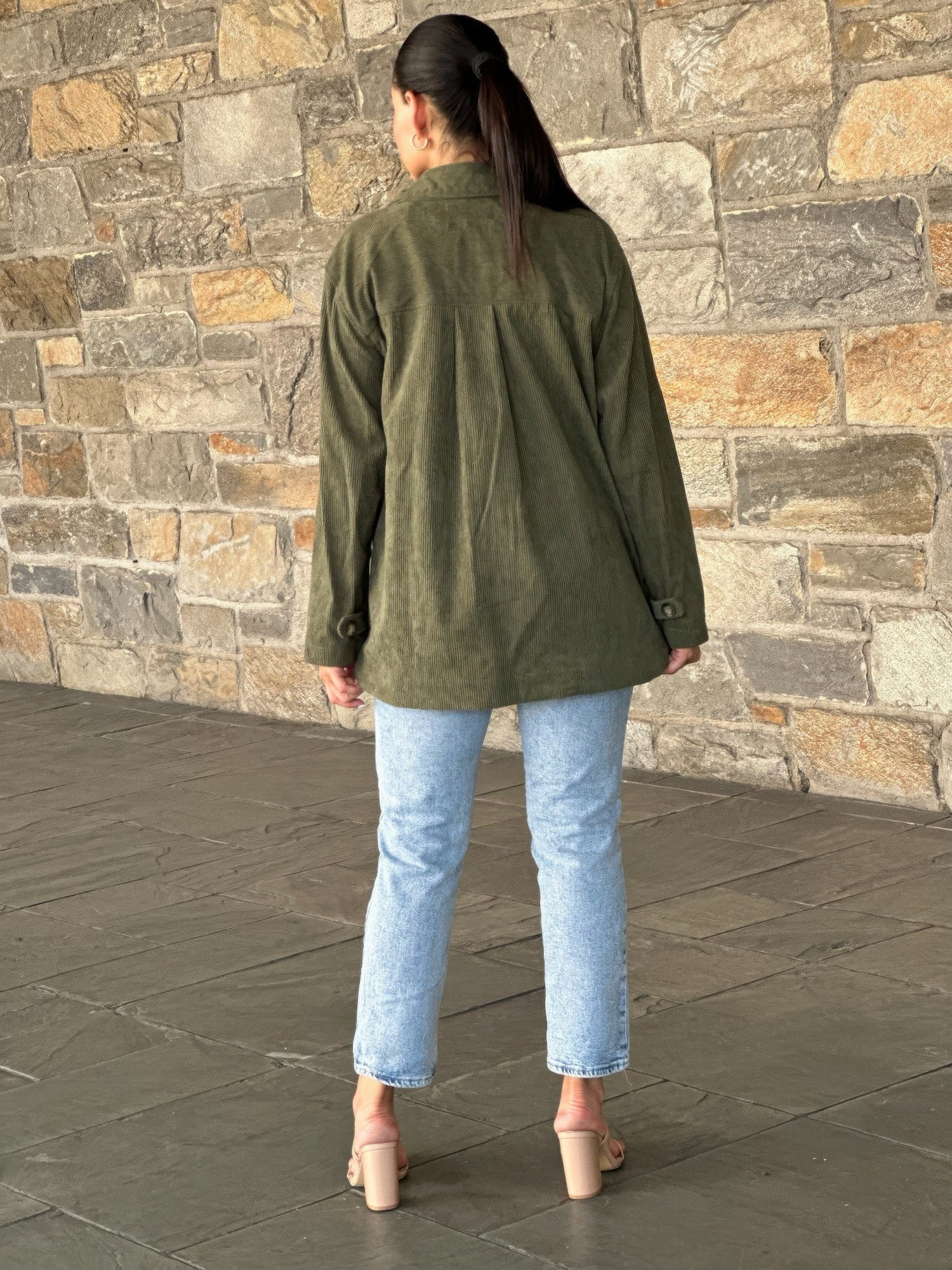 Back view of olive oversized corduroy shacket with button closure
