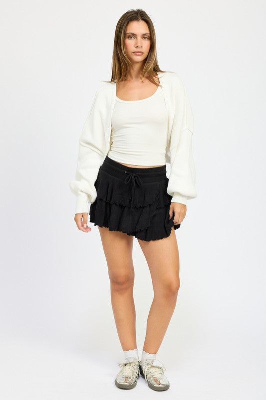 Off-white oversized shrug cardigan worn open, relaxed fit with long sleeves