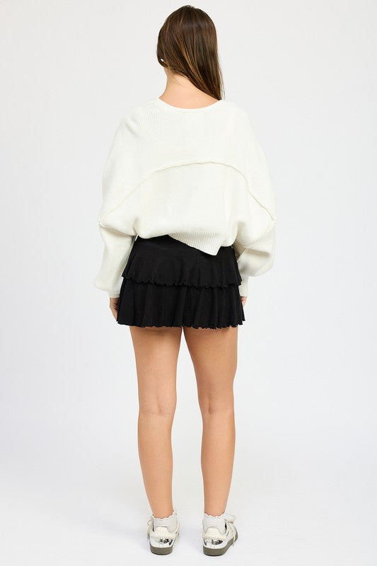Off white oversized shrug cardigan with wide sleeves and relaxed fit