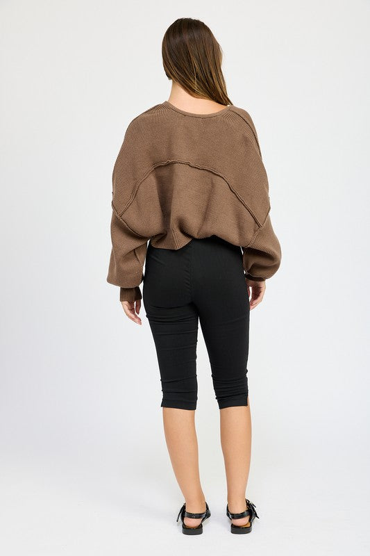 Back view of coffee brown oversized shrug cardigan with wide dropped shoulders