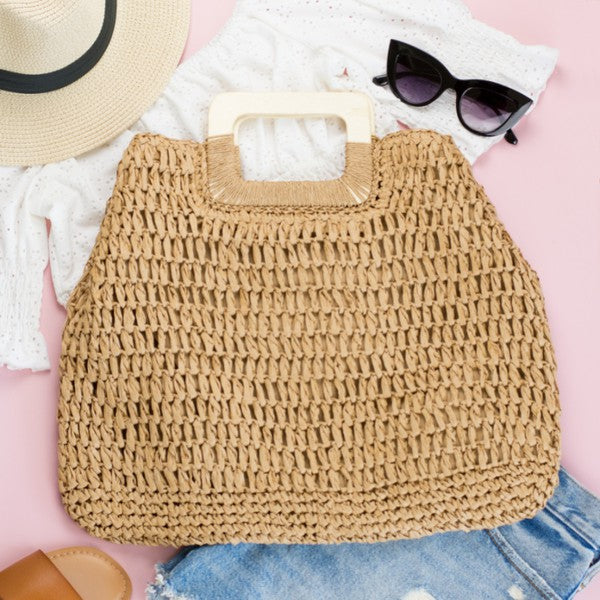 Khaki straw oversized tote, top view with open cutout handle and textured weave