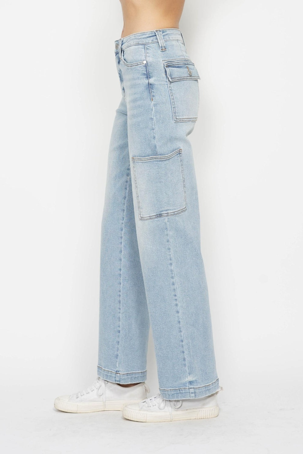 Light wash high-waist straight cargo jeans, back-side view with flap cargo pockets