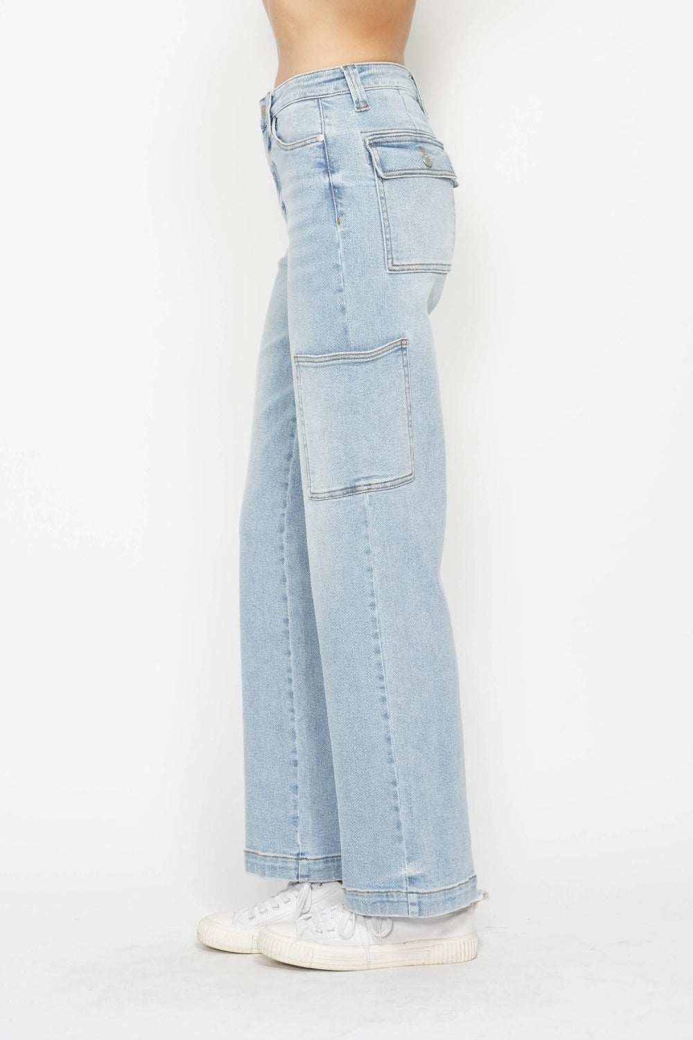 Light wash straight cargo jeans, back view with large patch pockets and seams