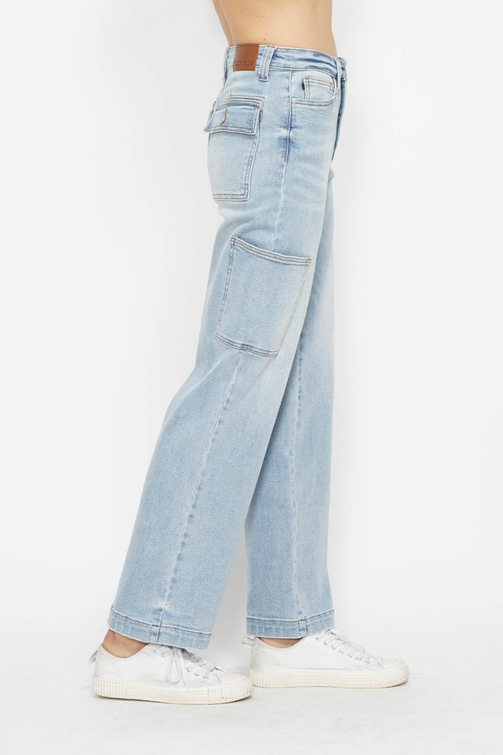 Light wash straight cargo jeans, front-side view with cargo pockets and relaxed fit