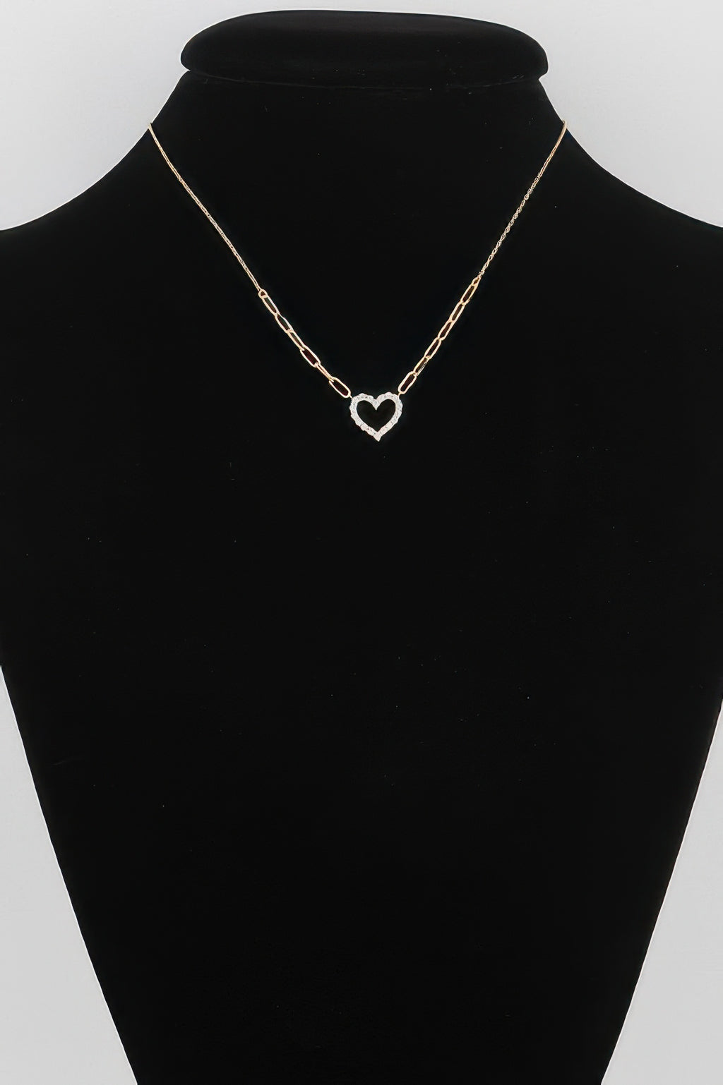 Gold paper-clip chain necklace with heart pendant on a delicate link collar
