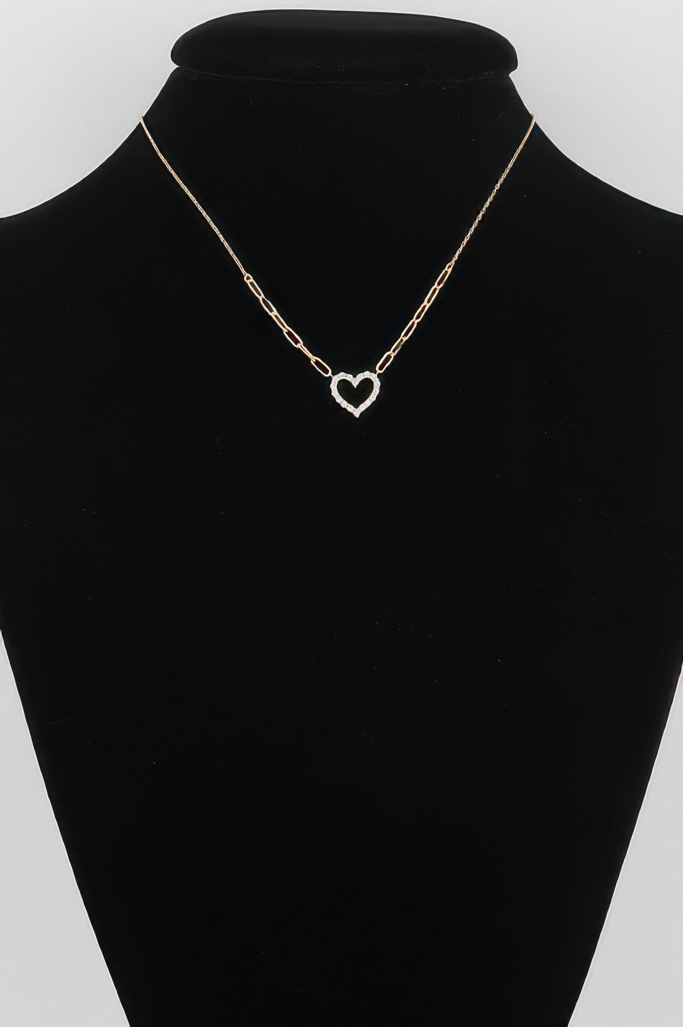 Gold paper-clip chain necklace with heart pendant on a delicate link collar