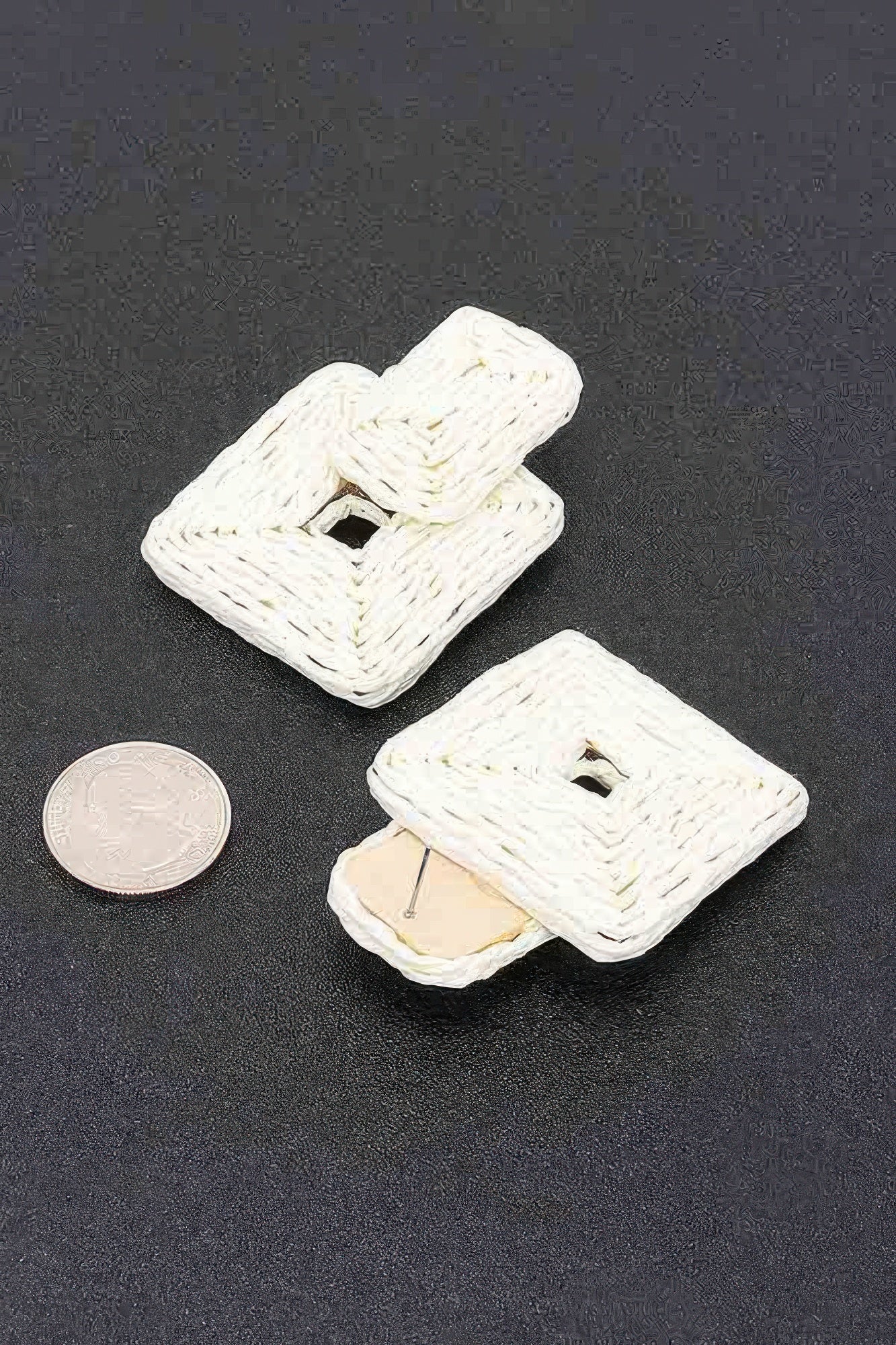 Ivory paper earrings, interwoven square with small opening and visible pin backing