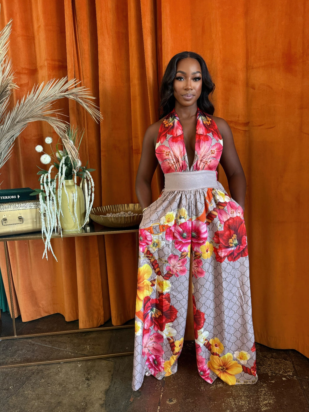 Paradise Bloom halter jumpsuit, red floral bodice, wide-leg print