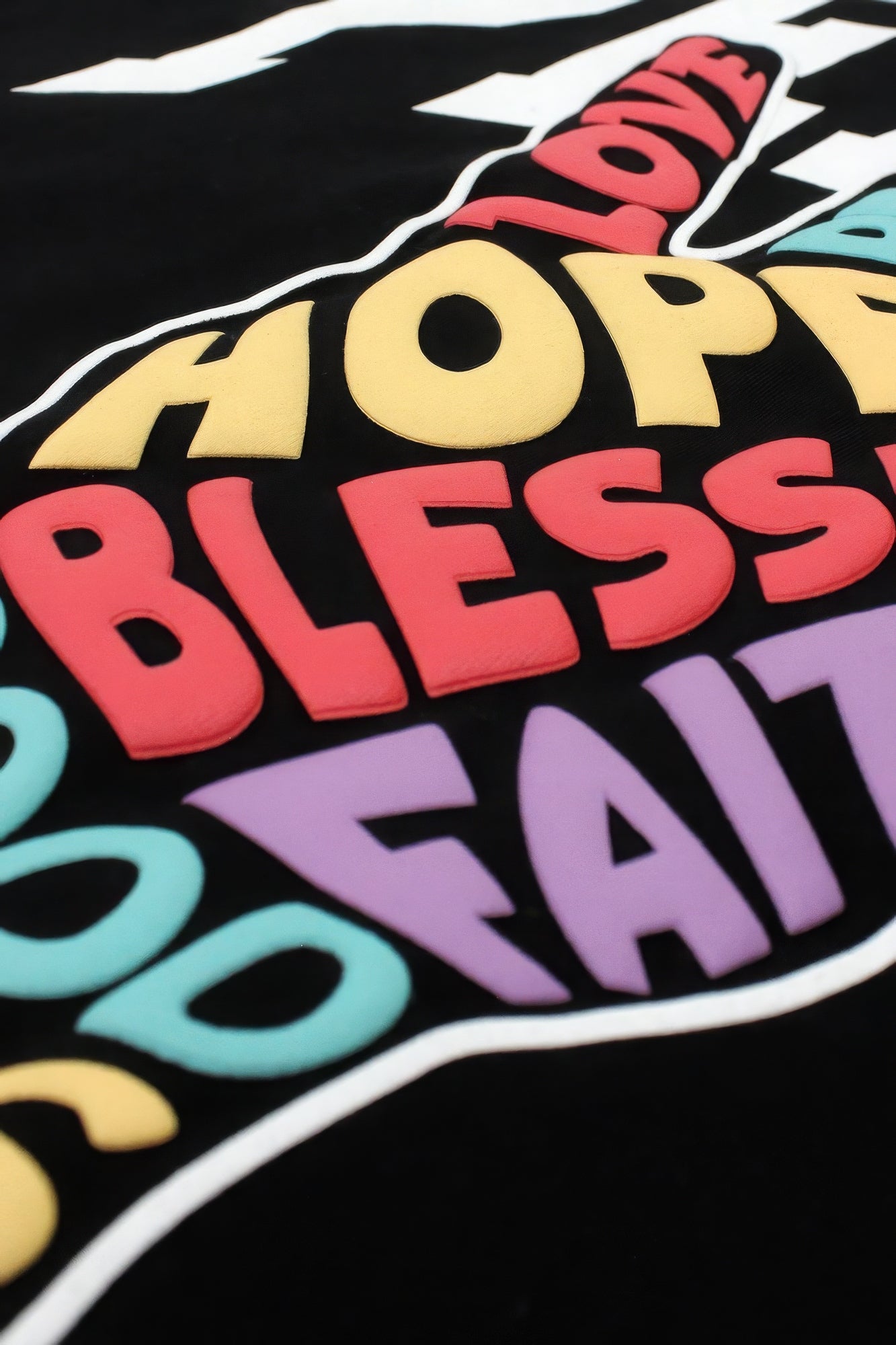 Close-up of colorful peace hand sign print with "GOOD VIBES" letters