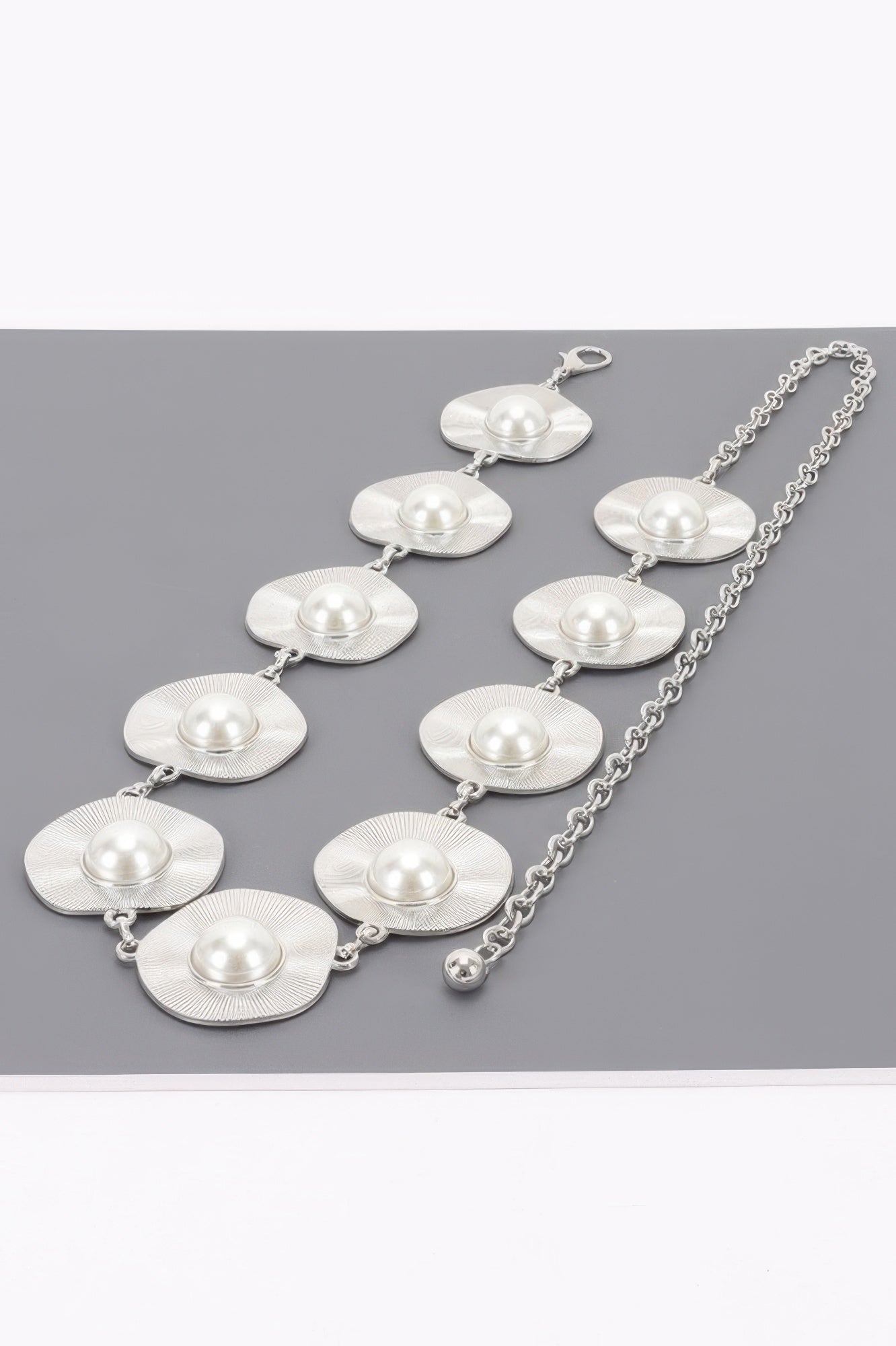 Silver pearl accent disc chain belt with linked chain and multiple round disc plates