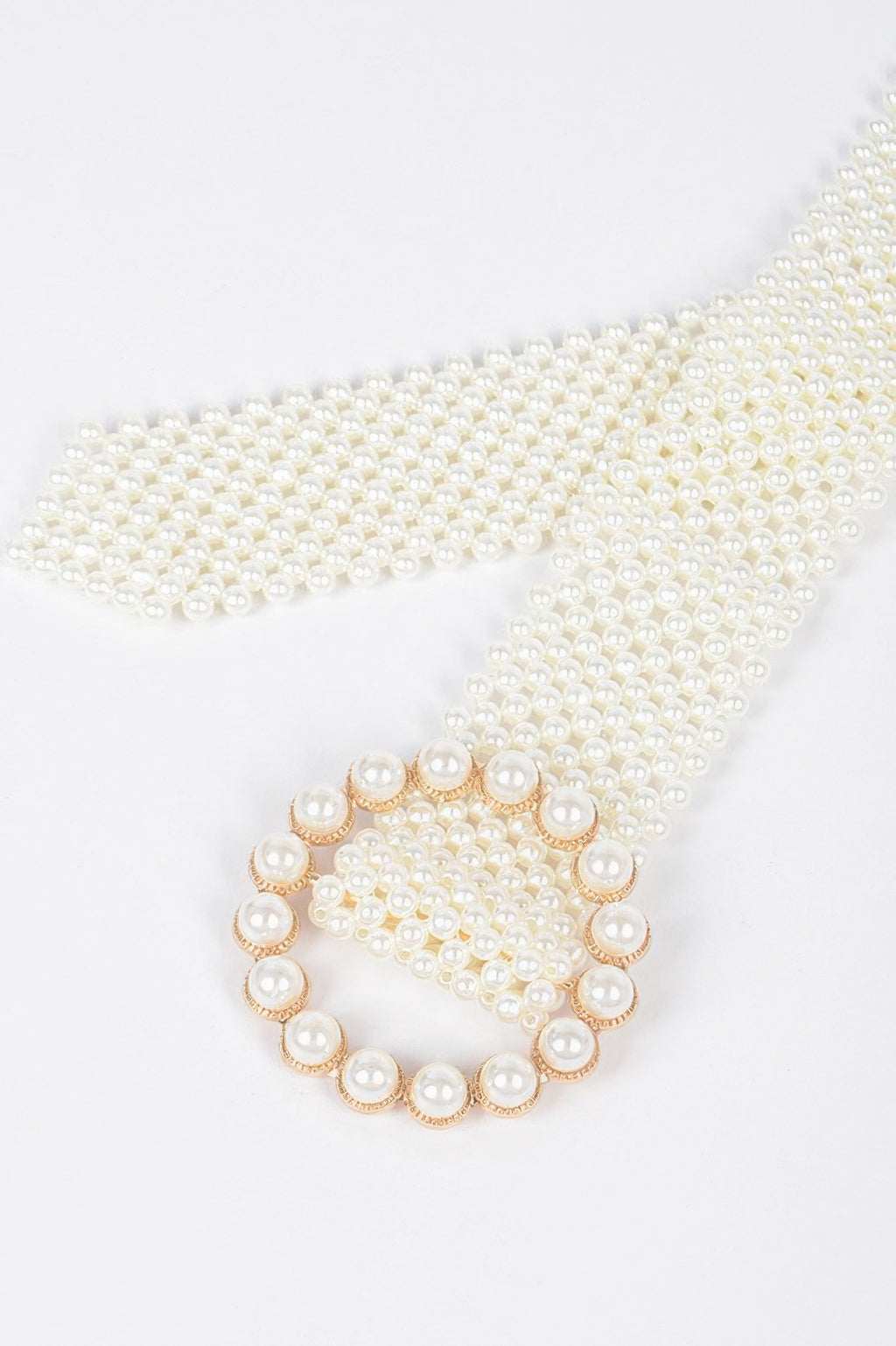 Circular pearl buckle detail on ivory pearl beaded belt
