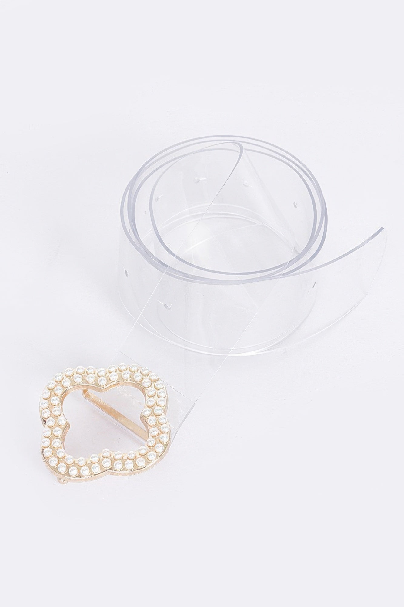 Clear belt buckle with faux pearl border and gold-tone center