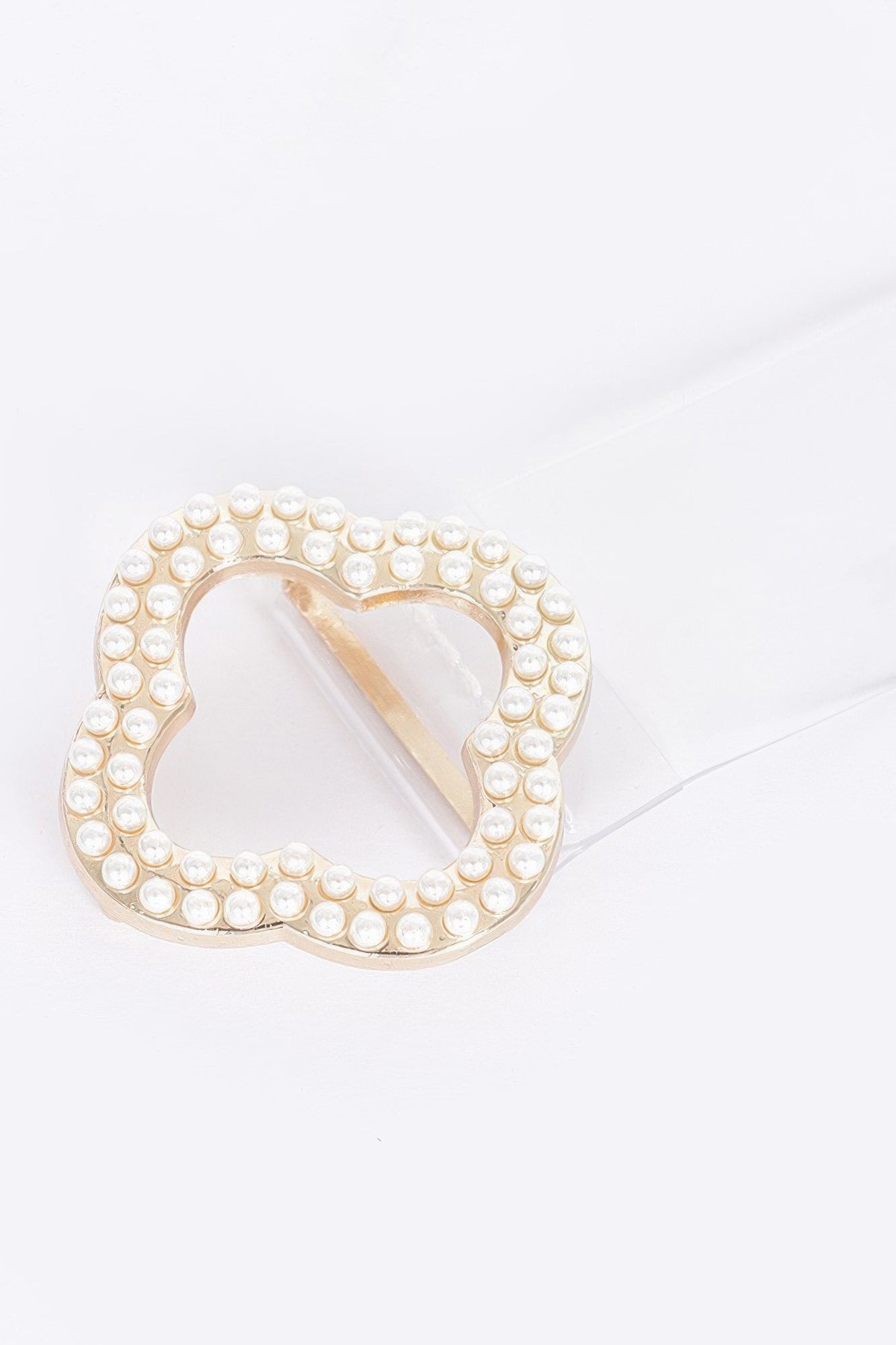 Pearl-studded ornate buckle with quatrefoil cutout