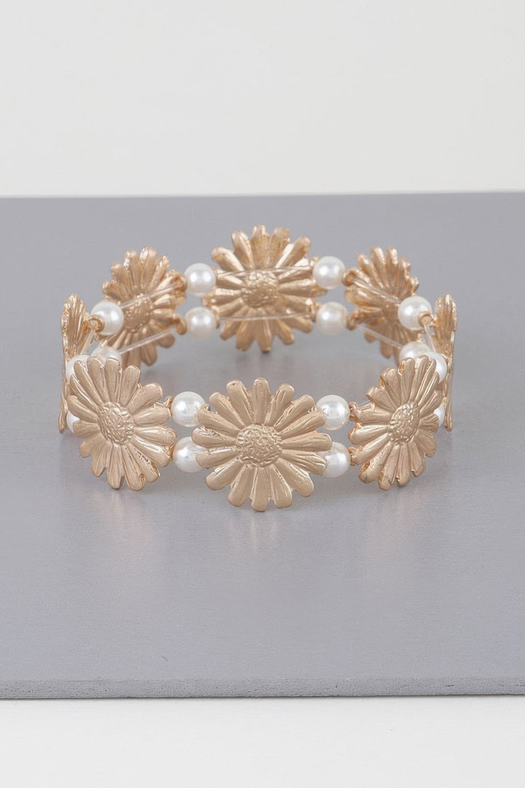 Gold-cream pearled sunflower bracelet, circular with scalloped flower charms and pearl links