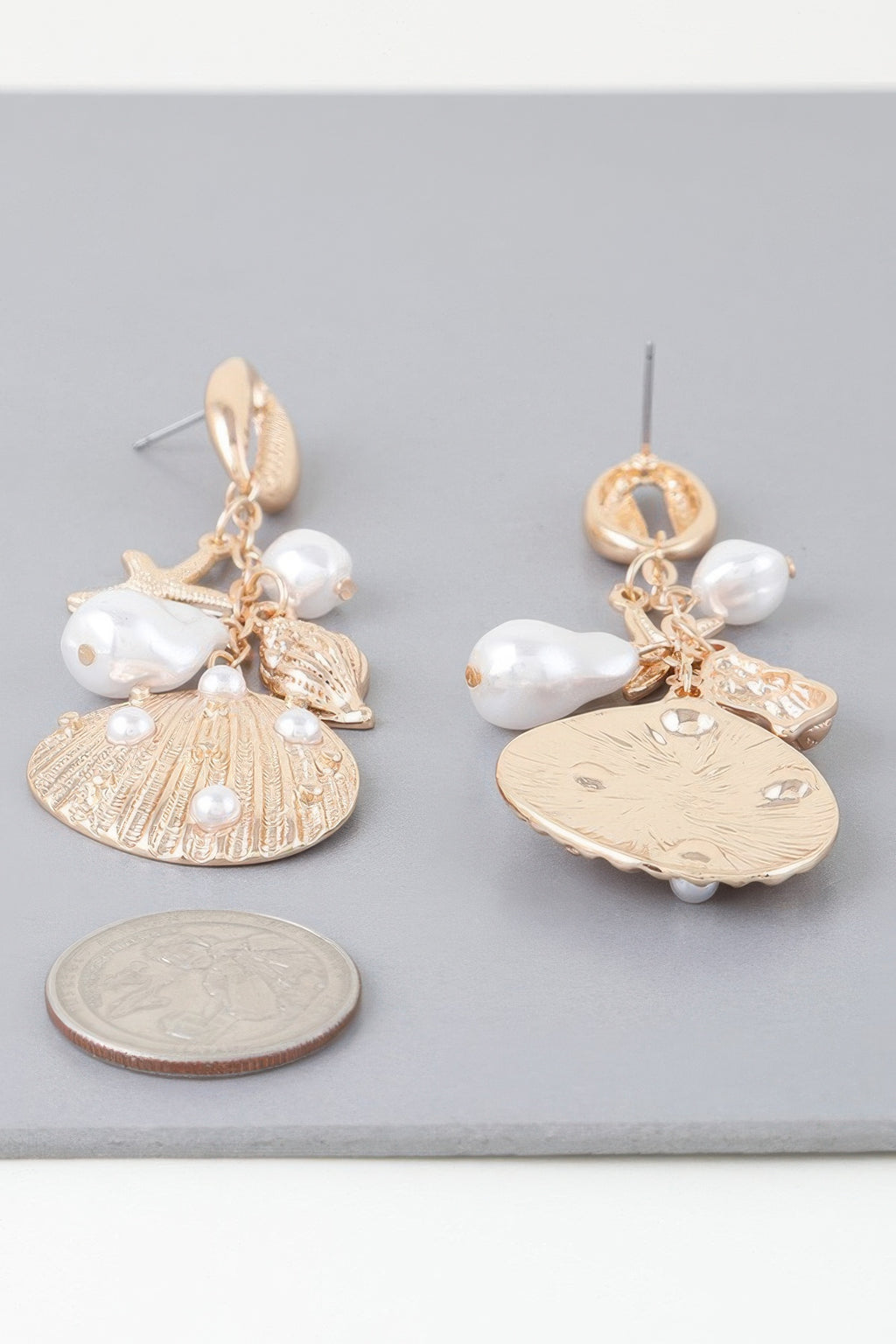Gold-cream undersea drop earrings with starfish, white pearls, shell-disc charms