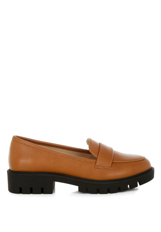 Peridot chunky loafers in tan faux leather, side view with black platform tread sole