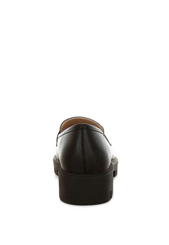 Black faux-leather chunky loafer back view, slip-on strap, thick sole