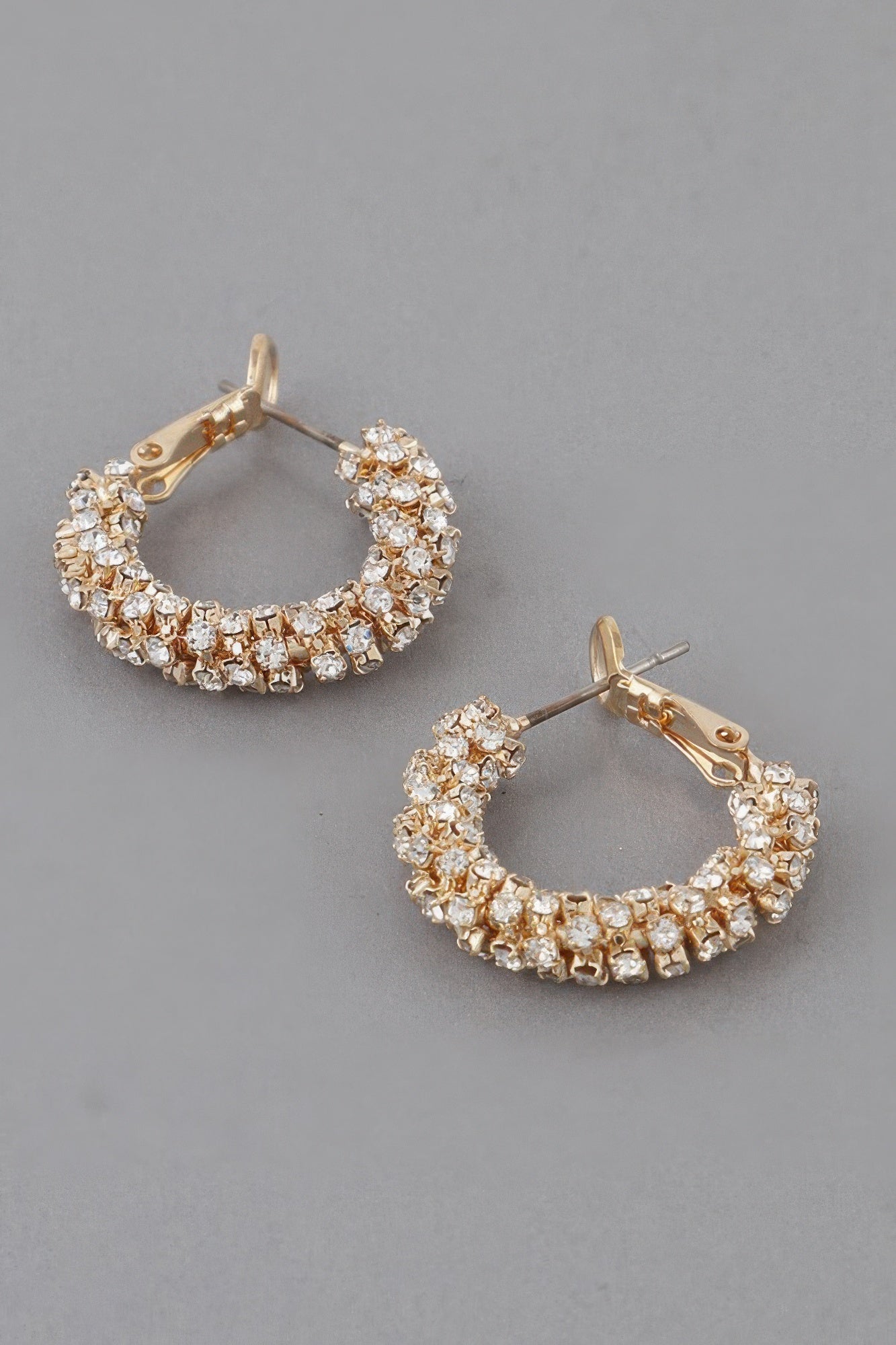 Petite bejeweled hoop earrings in gold, sparkling crystal pavé ring