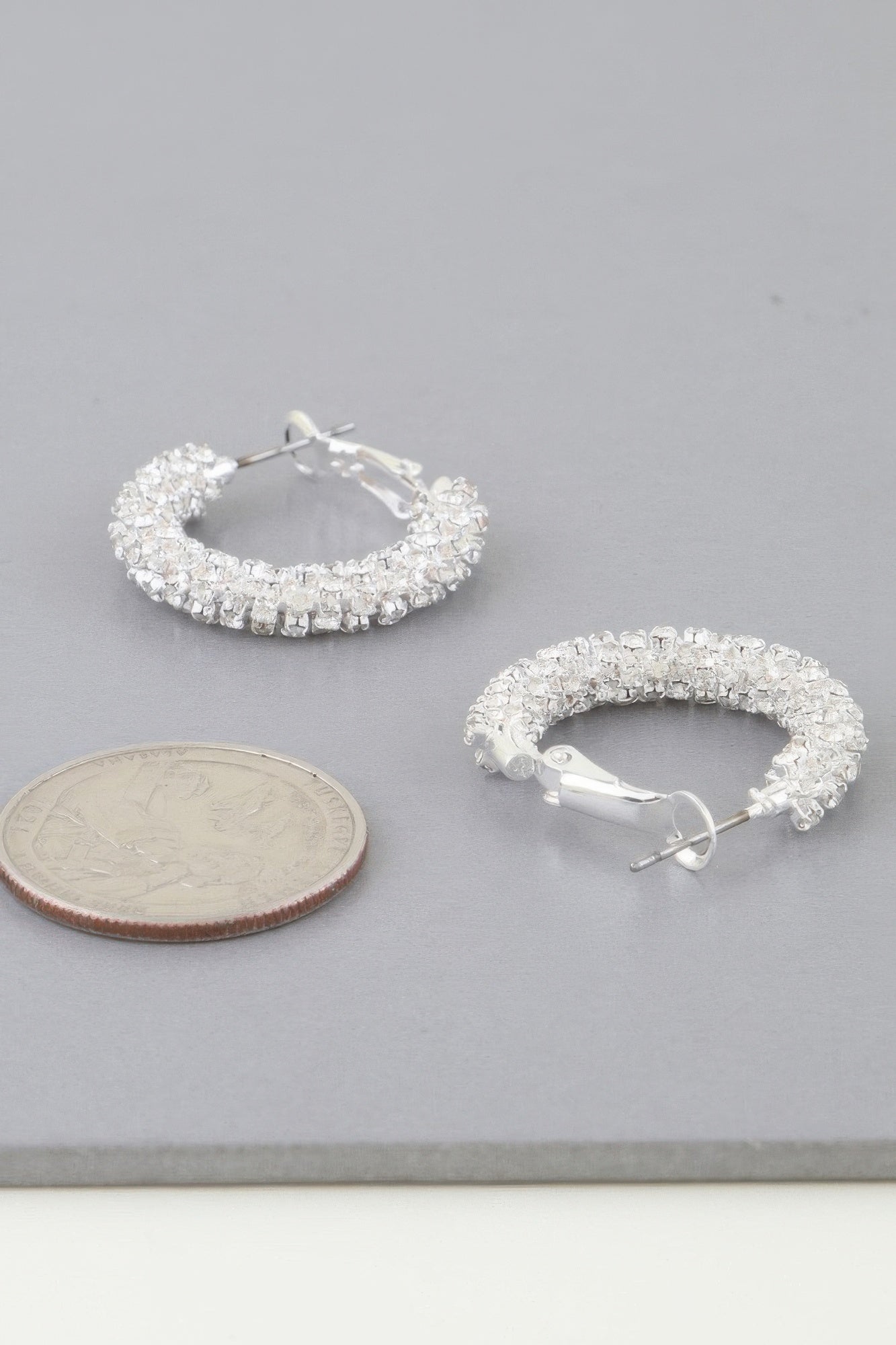 Silver crystal pavé hoop earrings with hinged clasp and small hoop shape