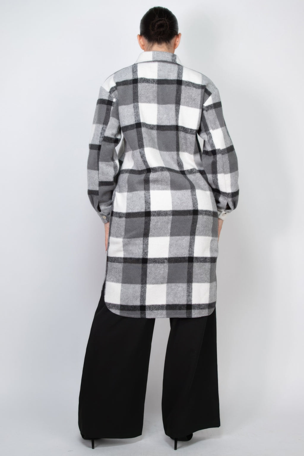 Back view of black-and-white plaid button shacket coat with collar