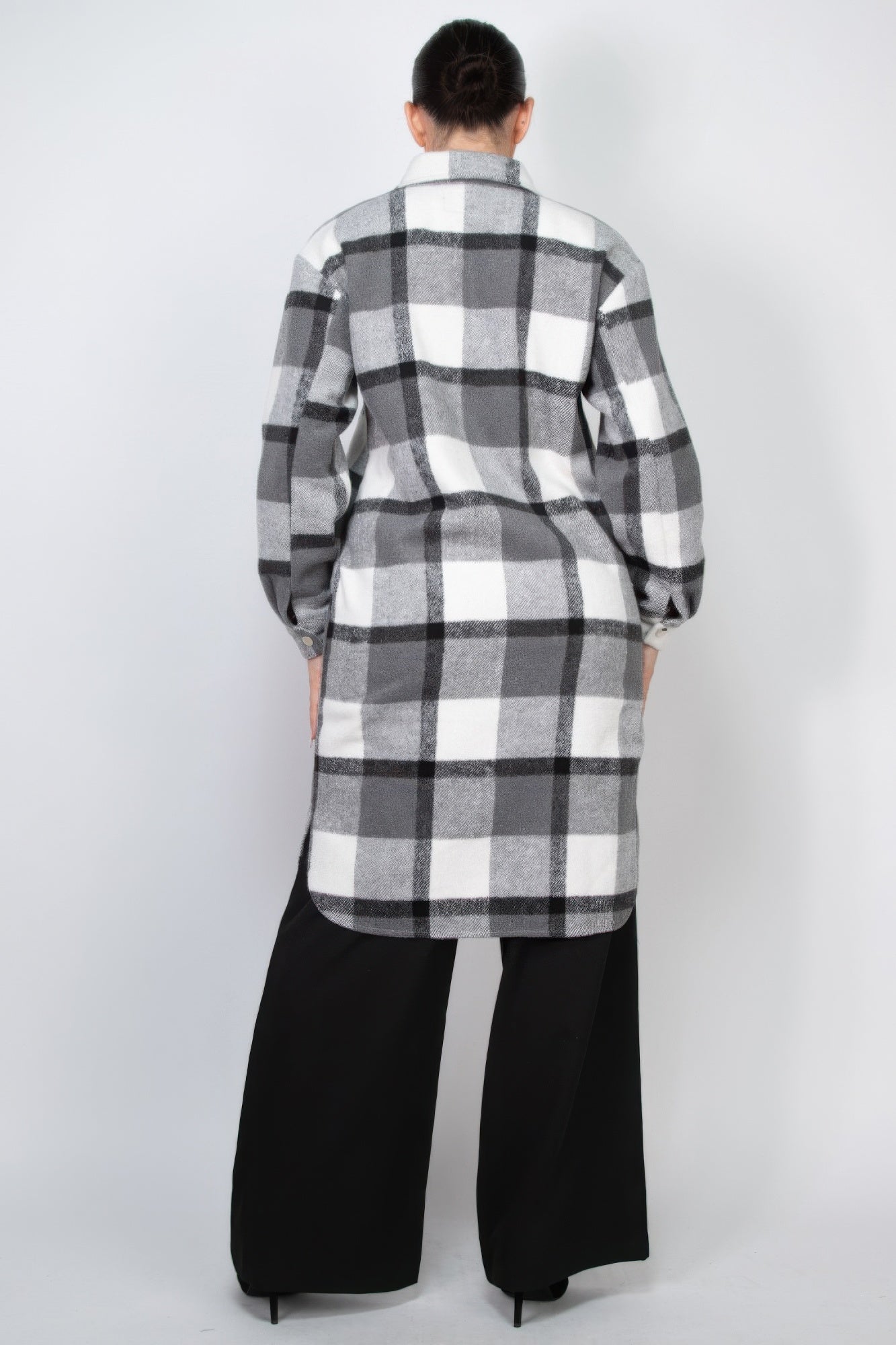 Back view of black-and-white plaid button shacket coat with collar