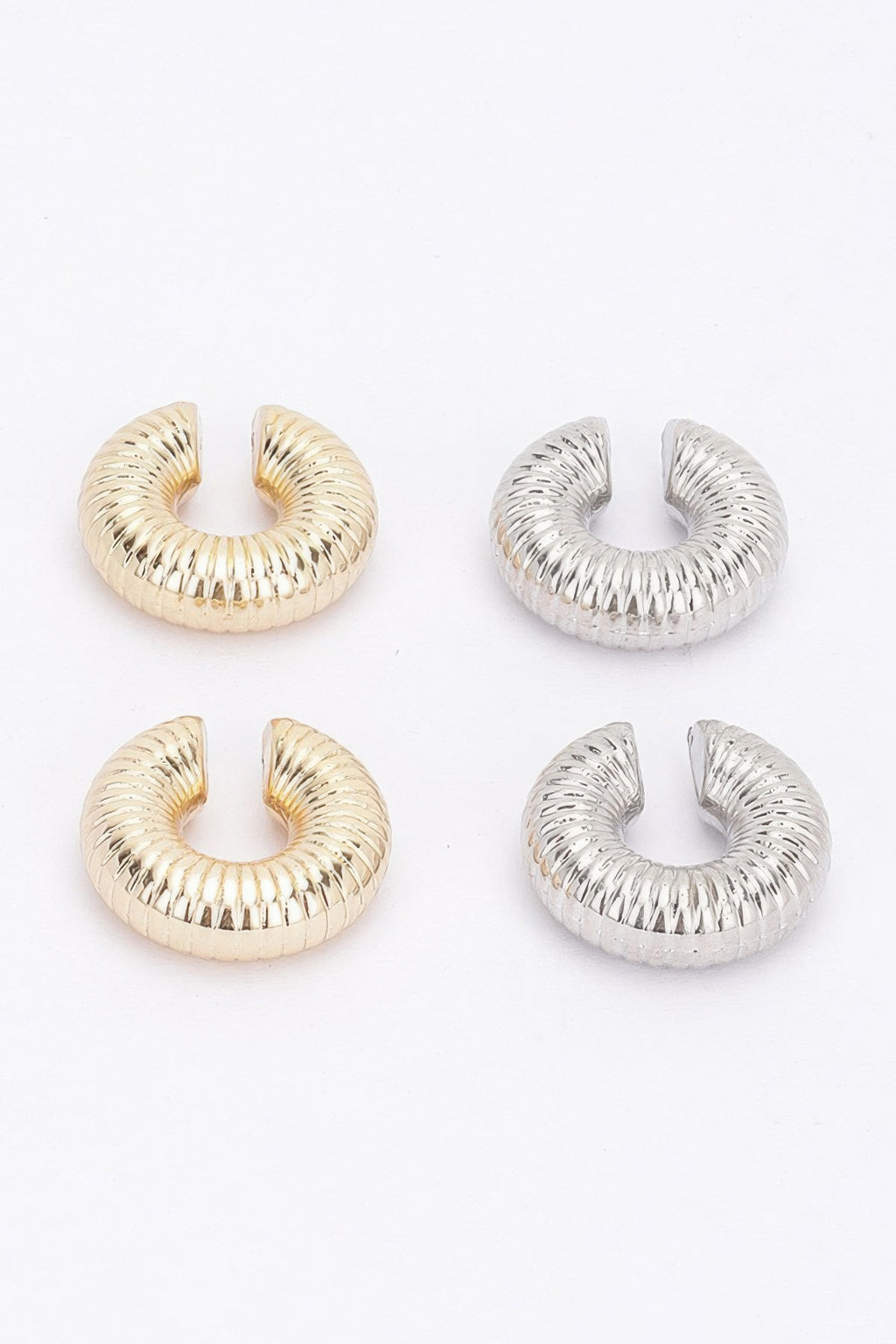 Assorted plastic cuff hoop earrings: gold and silver ridged spiral styles