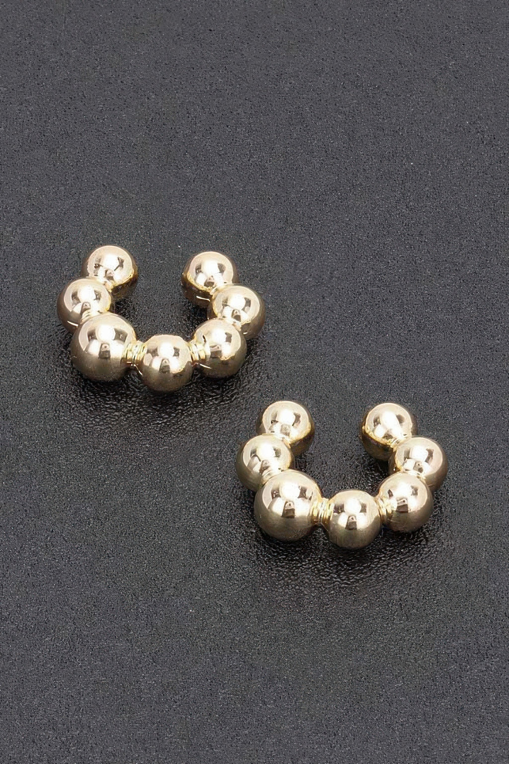 Gold plastic cuff hoop earrings with bead spheres, 3 per side, pair