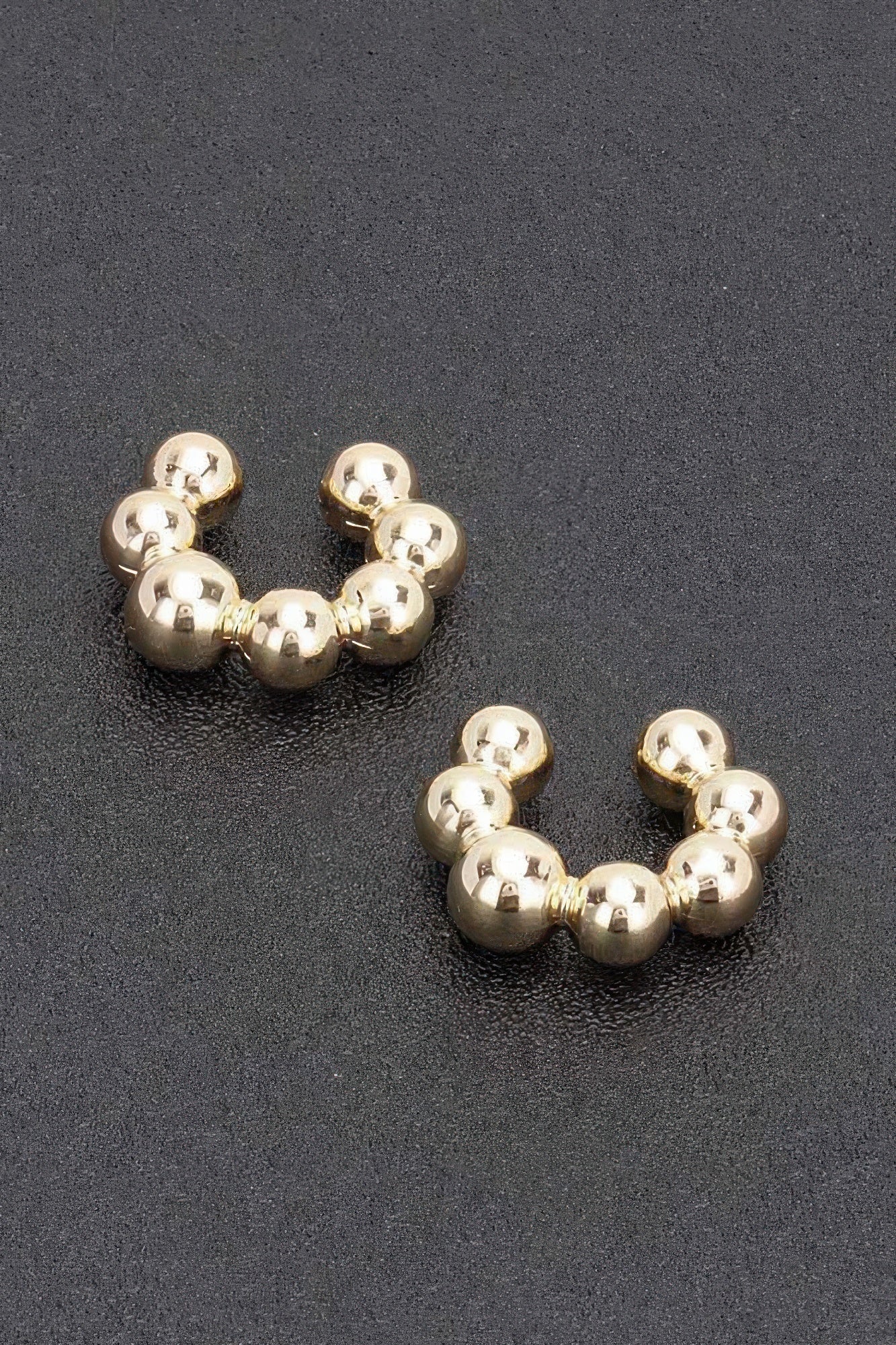 Gold plastic cuff hoop earrings with bead spheres, 3 per side, pair