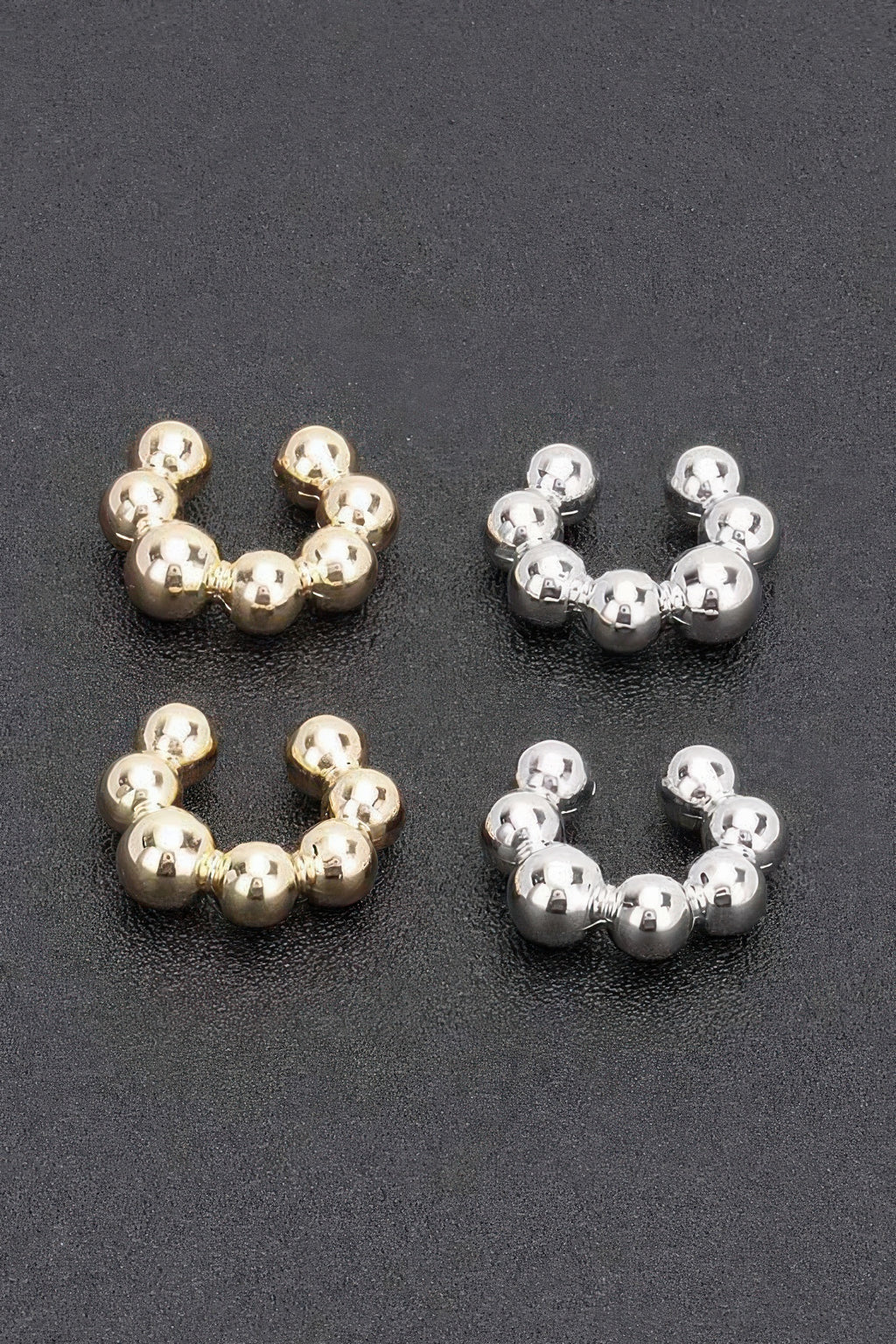 Tigbul's plastic cuff earrings: gold and silver beaded hoops, two pairs