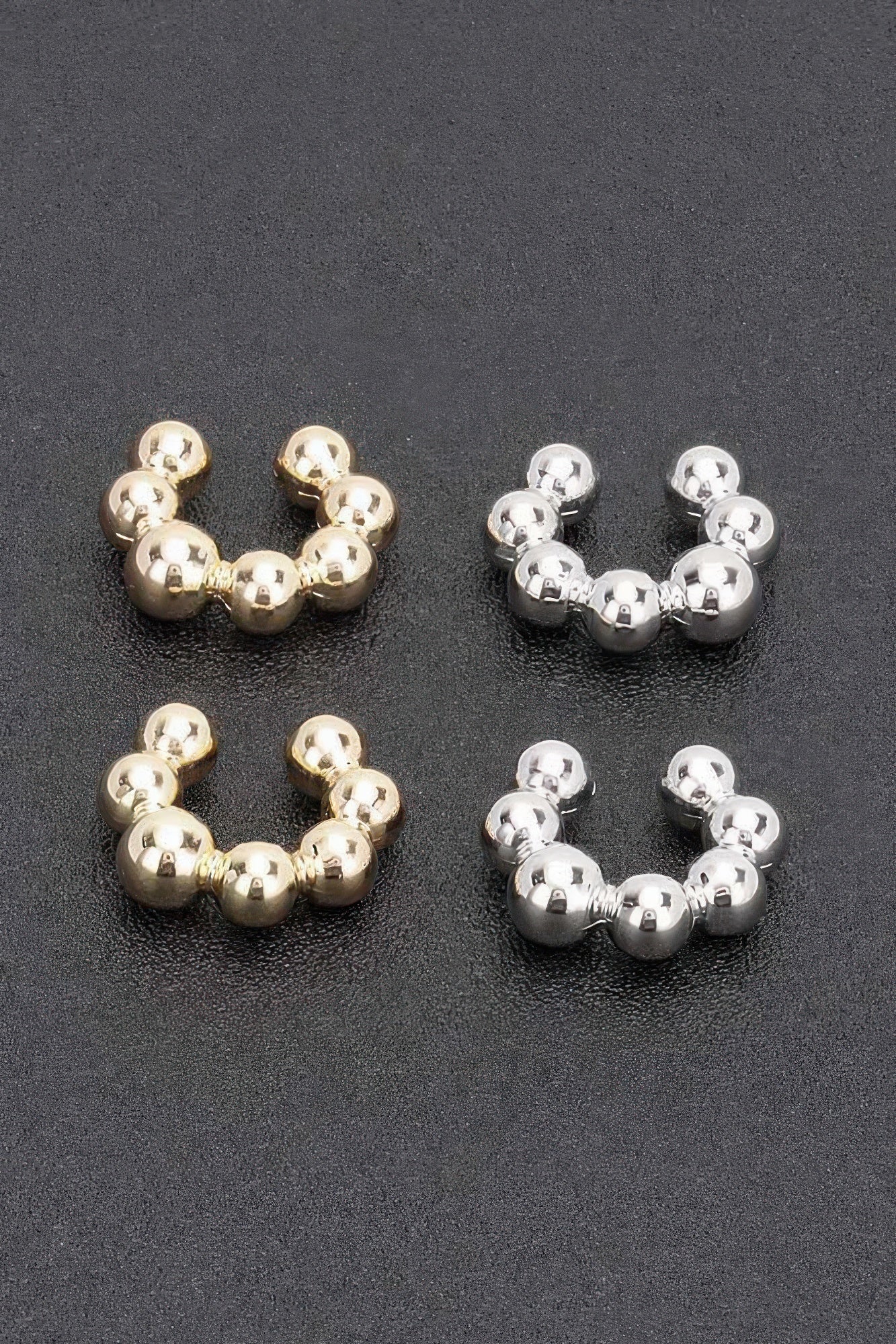 Tigbul's plastic cuff earrings: gold and silver beaded hoops, two pairs