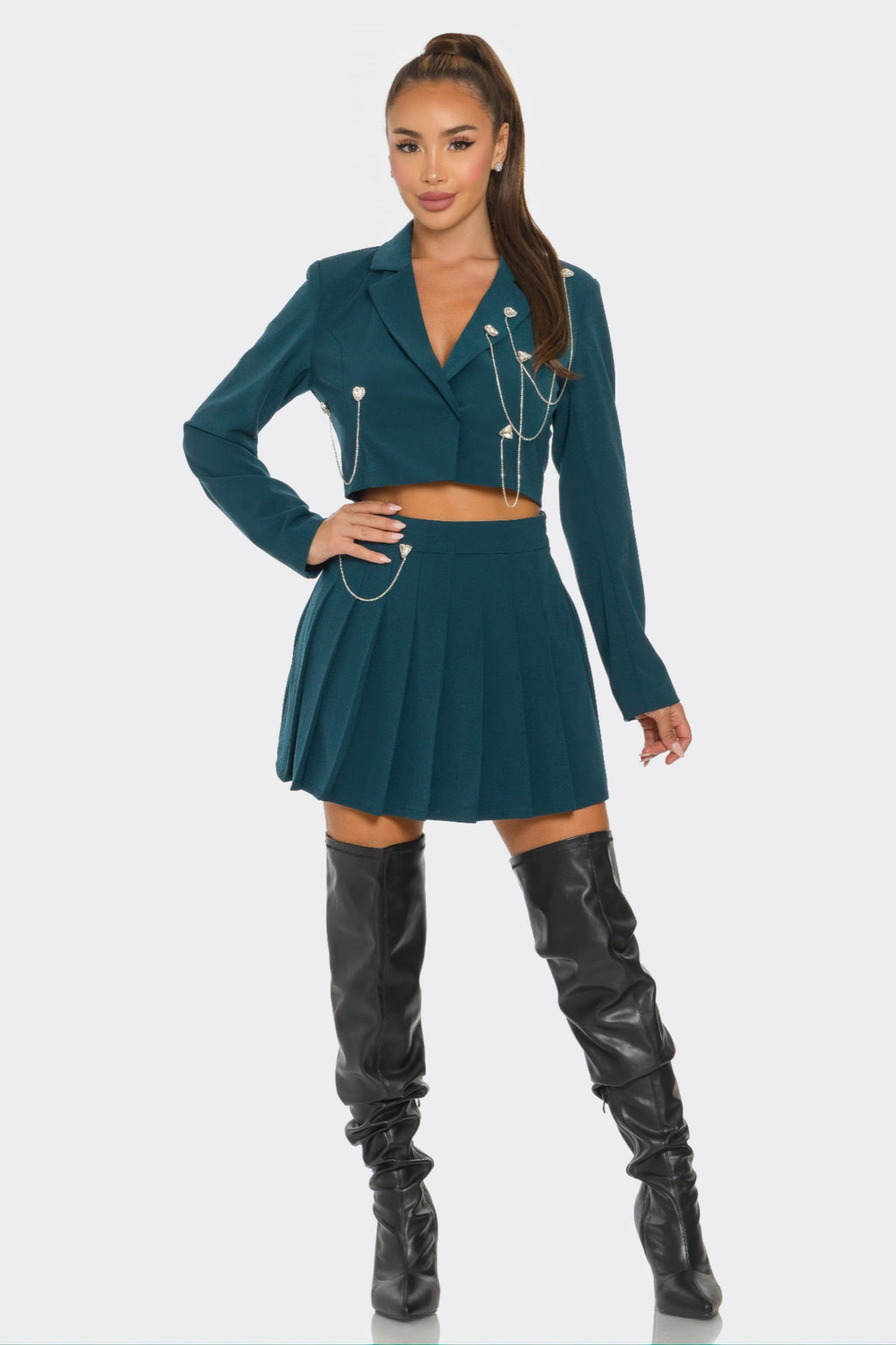 Teal pleated mini skirt set with cropped blazer and dangling chain accents