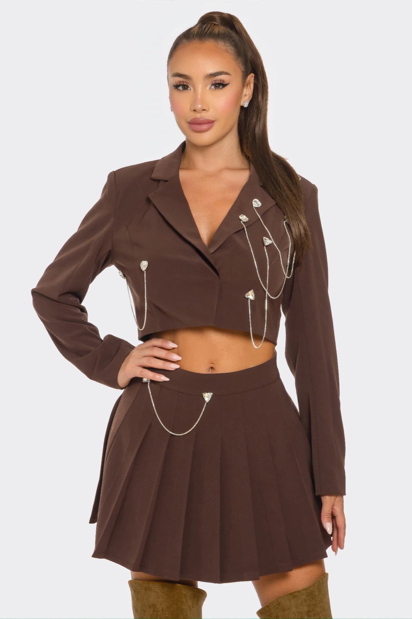 Chocolate brown pleated skirt set with cropped blazer and dangling silver chain accents