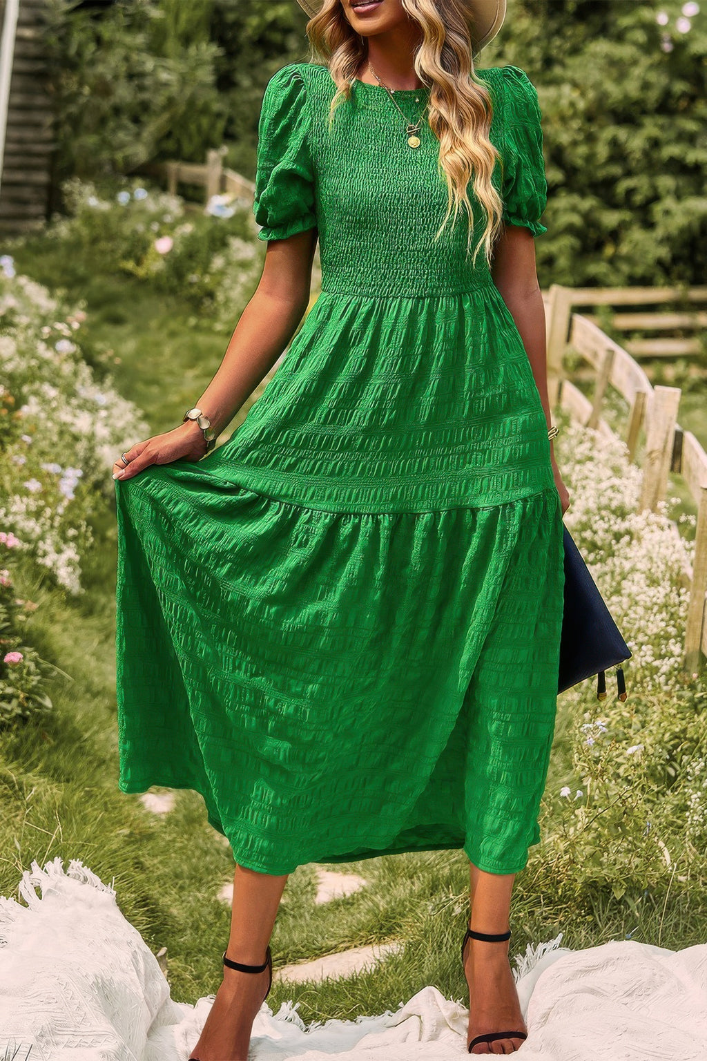 Tiered A-line dress in green with short puff sleeves and pleated skirt tiers