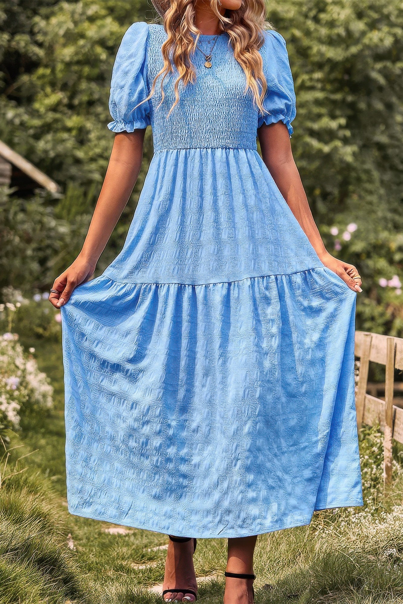 Light blue tiered A-line puff-sleeve dress with roomy skirt tiers
