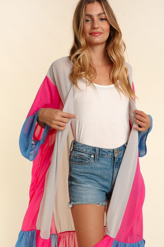 Open-front plus kimono cardigan close-up: taupe main with fuchsia and blue sleeve blocks