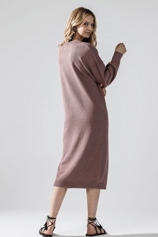 Brown knit midi sweater dress with button placket and relaxed long sleeves