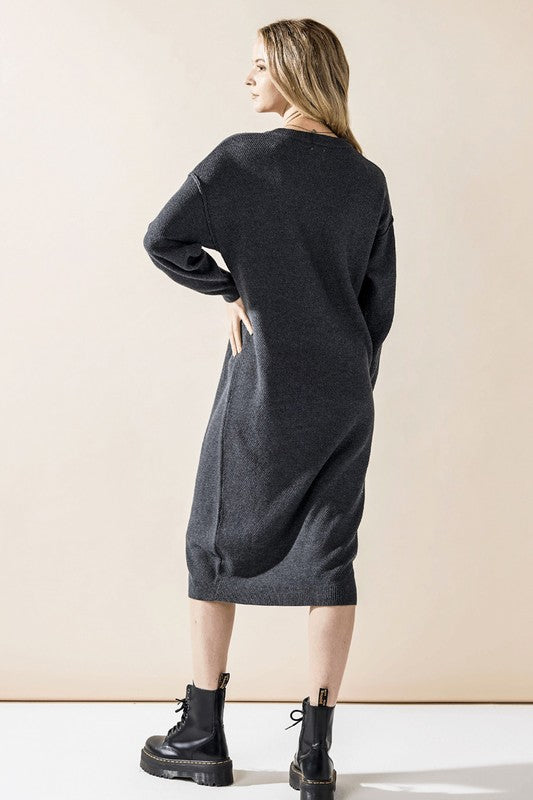 Charcoal gray knit midi sweater dress from back, long sleeves and draped hem