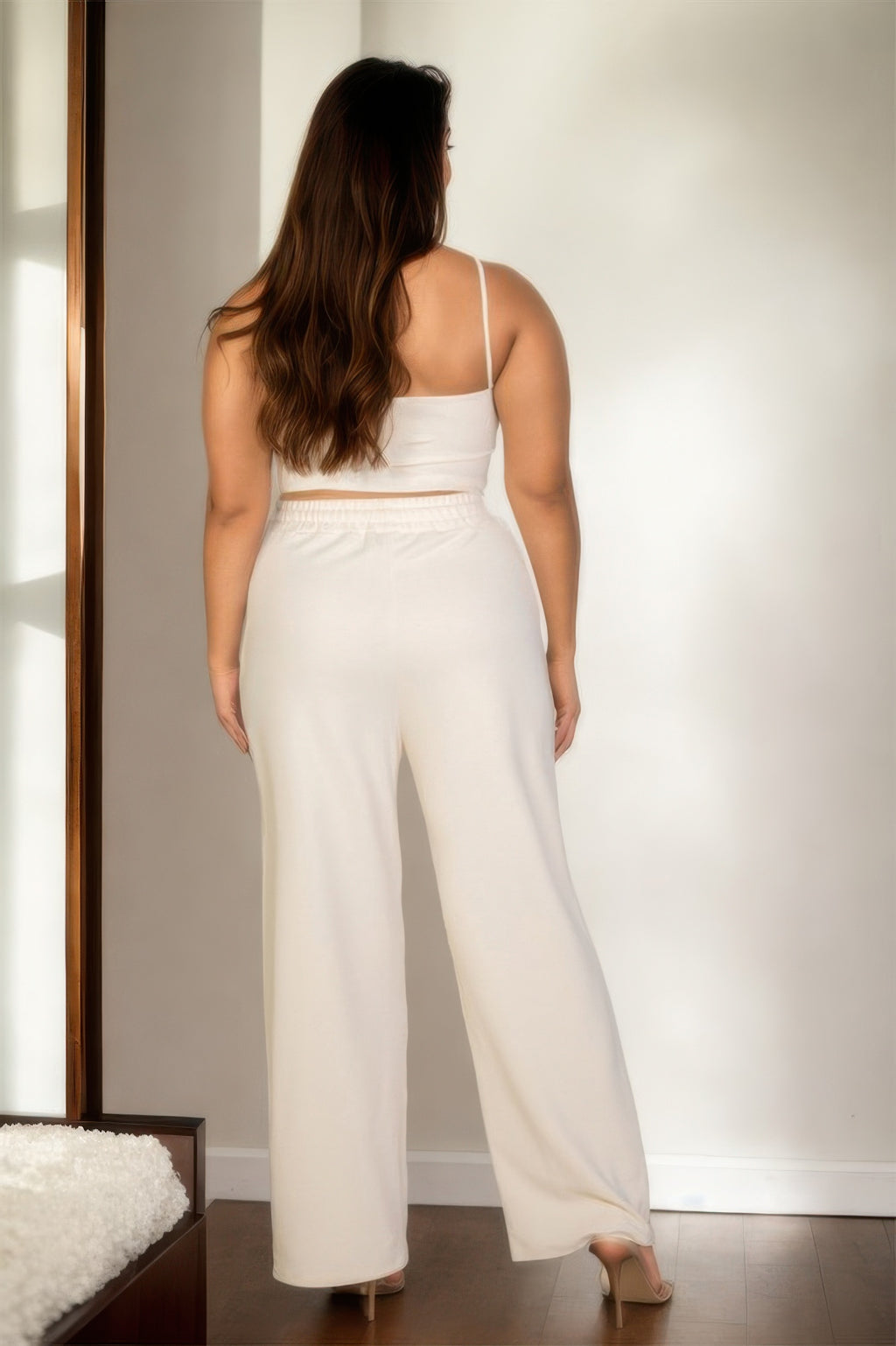 White back view bustier crop cami top with straight wide-leg pants, plus-size