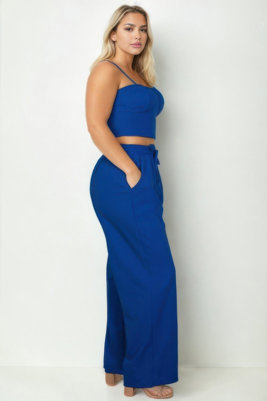 Royal blue sleeveless bustier crop top and wide straight pants with waist tie, plus-size