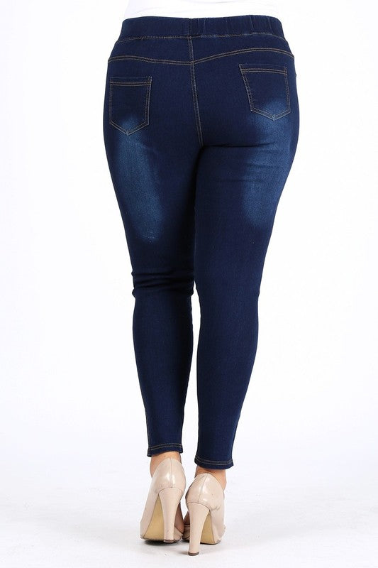Medium blue high-waist denim jeggings with back pockets and stitched seams